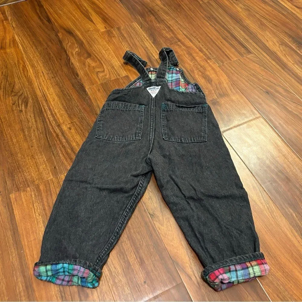 Osh Kosh B’Gosh Vintage black denim overalls with plaid accents.